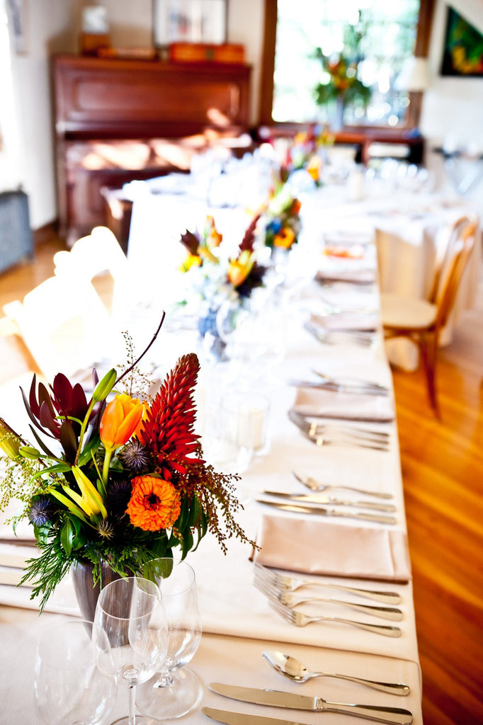 local grown flowers and aloe blooms for a wedding reception by Gorgeous and Green